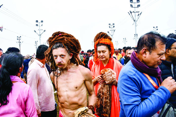 Foreign devotees gather to take a dip at Triveni Sangam on the occasion of Makar Sankranti during the Maha Kumbh 2025, in Prayagraj on 14 January. ANI Foreign devotees gather to take a dip at Triveni Sangam on the occasion of Makar Sankranti during the Maha Kumbh 2025, in Prayagraj on 14 January. ANI