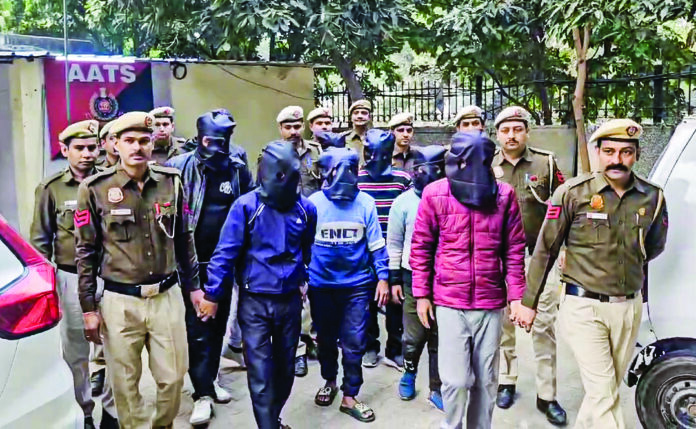 A 24 December 2024 photo of Delhi police arresting 11 people in connection with illegal Bangladeshi immigrants and fake documents racket, in New Delhi. ANI A 24 December 2024 photo of Delhi police arresting 11 people in connection with illegal Bangladeshi immigrants and fake documents racket, in New Delhi. ANI