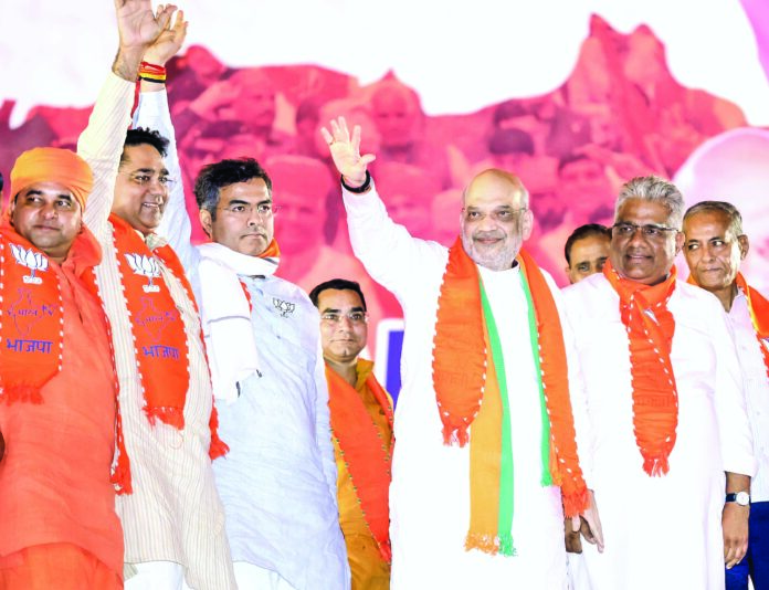 Union Home Minister Amit Shah with Union Minister for Environment, Forest & Climate Change Bhupender Yadav and Parvesh Verma (Left) at a public meeting ahead of Lok Sabha polls, in Alwar on April 13, 2024. ANI Union Home Minister Amit Shah with Union Minister for Environment, Forest & Climate Change Bhupender Yadav and Parvesh Verma (Left) at a public meeting ahead of Lok Sabha polls, in Alwar on April 13, 2024. ANI