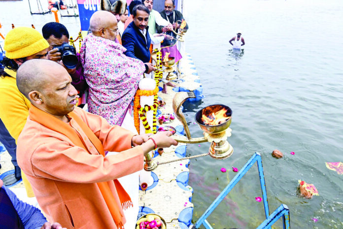 Uttar Pradesh Chief Minister Yogi Adityanath performs aarti at Sangam Noj Ghat, in Prayagraj on 31 Dec 2024. ANI Uttar Pradesh Chief Minister Yogi Adityanath performs aarti at Sangam Noj Ghat, in Prayagraj on 31 Dec 2024. ANI