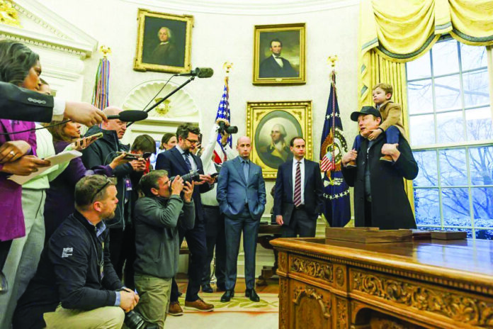 Elon Musk, holding his son X, speaks to the press in the Oval Office of the White House during a meeting with Donald Trump in Washington, US. Source: Agency Elon Musk, holding his son X, speaks to the press in the Oval Office of the White House during a meeting with Donald Trump in Washington, US. Source: Agency
