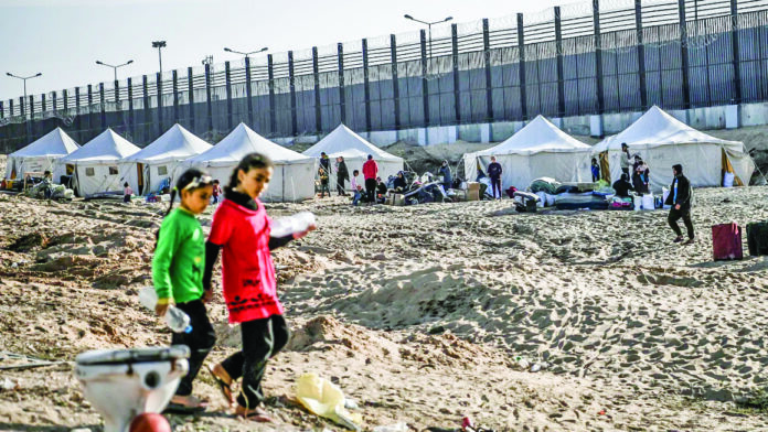 Displaced Palestinians living in makeshift tents set up in the empty area near the Egyptian border in Rafah, Gaza on January 22. File Photo Displaced Palestinians living in makeshift tents set up in the empty area near the Egyptian border in Rafah, Gaza on January 22. File Photo