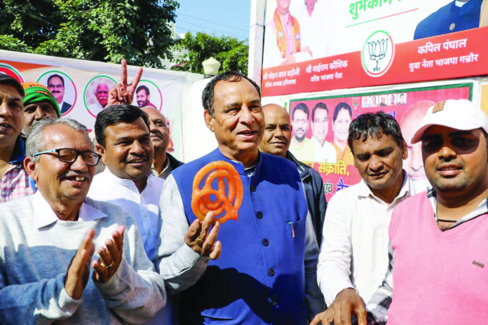 Haryana BJP President Mohan Lal Badoli celebrating party’s victory in Delhi.
