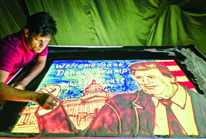 Manas Kumar Sahoo creates a sand art to congratulate Donald J. Trump on his victory