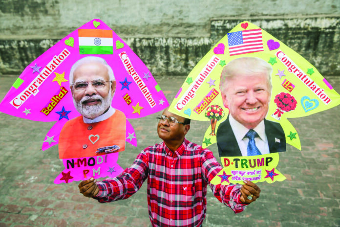 A kite artist poses with his kites made with pictures of Prime Minister Narendra Modi and newly elected U.S. President Donald Trump, in Amritsar on 6 November 2024. ANI A kite artist poses with his kites made with pictures of Prime Minister Narendra Modi and newly elected U.S. President Donald Trump, in Amritsar on 6 November 2024. ANI