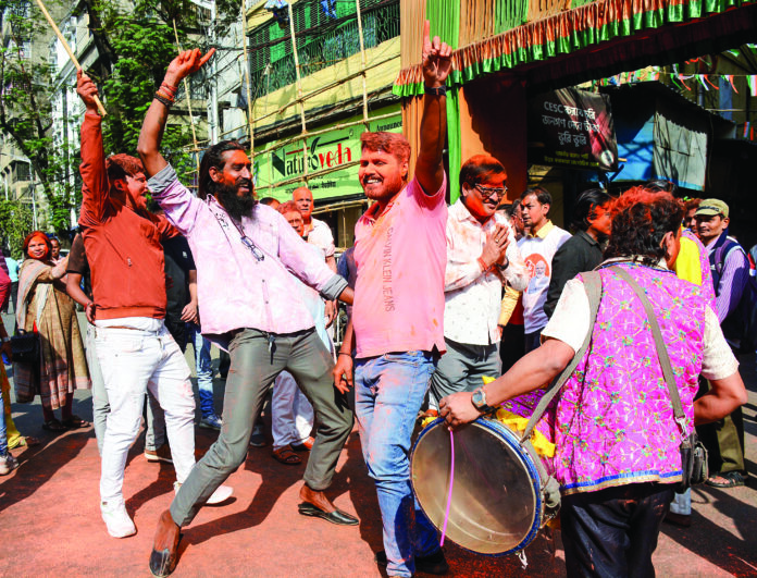 BJP workers celebrate party’s Delhi victory, in Kolkata. ANI