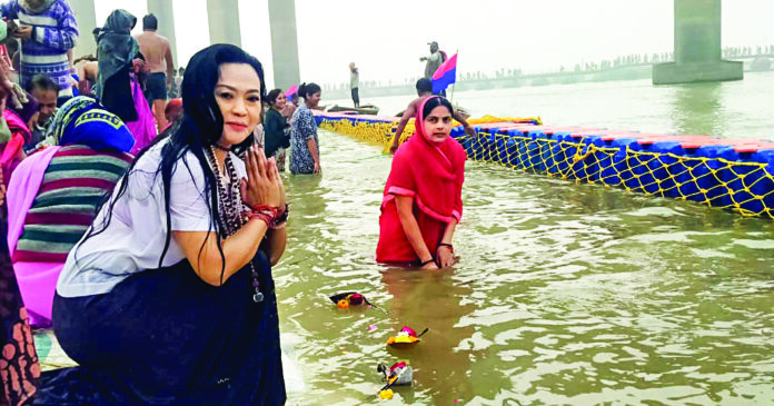 A foreign tourist offers prayers at Triveni Sangam on the occasion of ‘Paush Purnima’ during the Maha Kumbh 2025, in Prayagraj on Jan 13. ANI A foreign tourist offers prayers at Triveni Sangam on the occasion of ‘Paush Purnima’ during the Maha Kumbh 2025, in Prayagraj on Jan 13. ANI