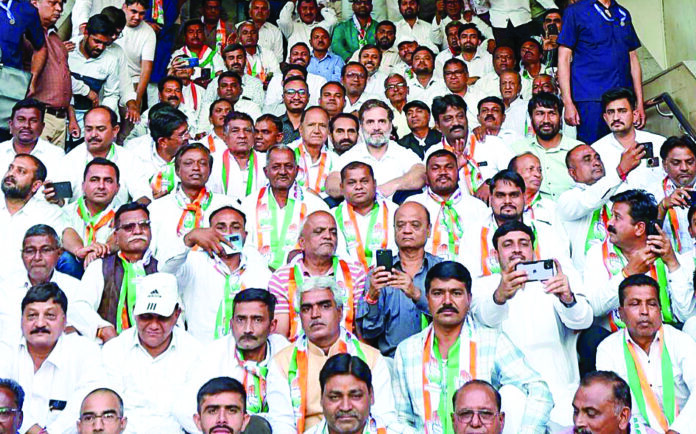 Leader of Opposition and Congress MP Rahul Gandhi in a group picture with party block presidents, in Ahmedabad on Friday. ANI Leader of Opposition and Congress MP Rahul Gandhi in a group picture with party block presidents, in Ahmedabad on Friday. ANI