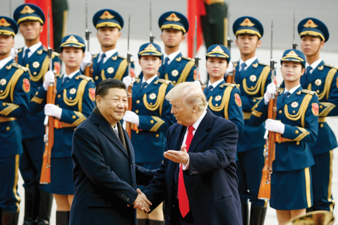Chinese President Xi Jinping and U.S. President Donald Trump attend a ceremony in Beijing on Nov. 9, 2017. File Photo Chinese President Xi Jinping and U.S. President Donald Trump attend a ceremony in Beijing on Nov. 9, 2017. File Photo