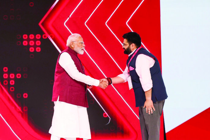 Prime Minister Narendra Modi with Rajya Sabha Member Kartikeya Sharma at the launch of NewsX World.