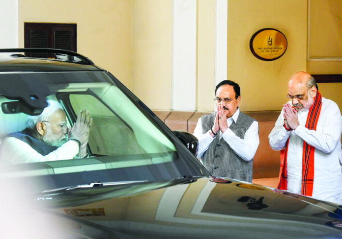 PM Modi exchanges greetings with BJP President J.P. Nadda and Union Home Minister Amit Shah, in New Delhi on 20 February. ANI PM Modi exchanges greetings with BJP President J.P. Nadda and Union Home Minister Amit Shah, in New Delhi on 20 February. ANI