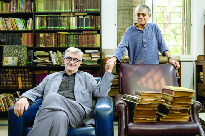 Wim Wenders during a visit to Satyajit Ray’s house in Kolkata where he also met his son Sandeep Ray. Photo: Rojot Dey ©️Goethe-Institut/Max Mueller Bhavan, Film Heritage Foundation, Wim Wenders Stiftung Wim Wenders during a visit to Satyajit Ray’s house in Kolkata where he also met his son Sandeep Ray. Photo: Rojot Dey ©️Goethe-Institut/Max Mueller Bhavan, Film Heritage Foundation, Wim Wenders Stiftung