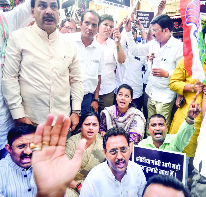 Cong MP Praniti Shinde and other leaders stage a protest outside Tilak Bhavan over the ED filed a chargesheet against the Parliamentary Party Chairperson Sonia Gandhi, Lok Sabha LoP Rahul Gandhi and others, in Mumbai, on April 17. ANI Cong MP Praniti Shinde and other leaders stage a protest outside Tilak Bhavan over the ED filed a chargesheet against the Parliamentary Party Chairperson Sonia Gandhi, Lok Sabha LoP Rahul Gandhi and others, in Mumbai, on April 17. ANI