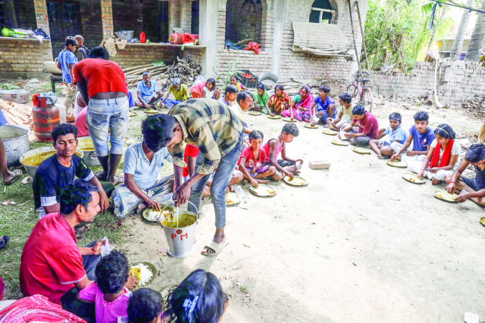 Children eat food at the violence-affected Beldona area under Samsergunj PS, in Murshidabad on Tuesday. ANI Children eat food at the violence-affected Beldona area under Samsergunj PS, in Murshidabad on Tuesday. ANI