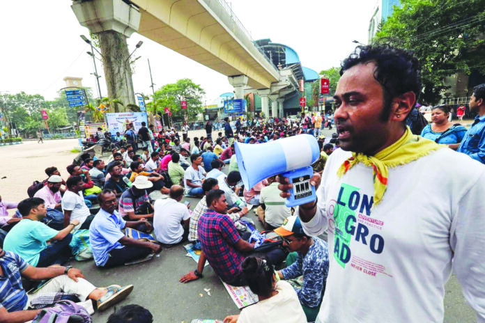Teachers and non-teaching staff affected by SC verdict stage sit-in protest